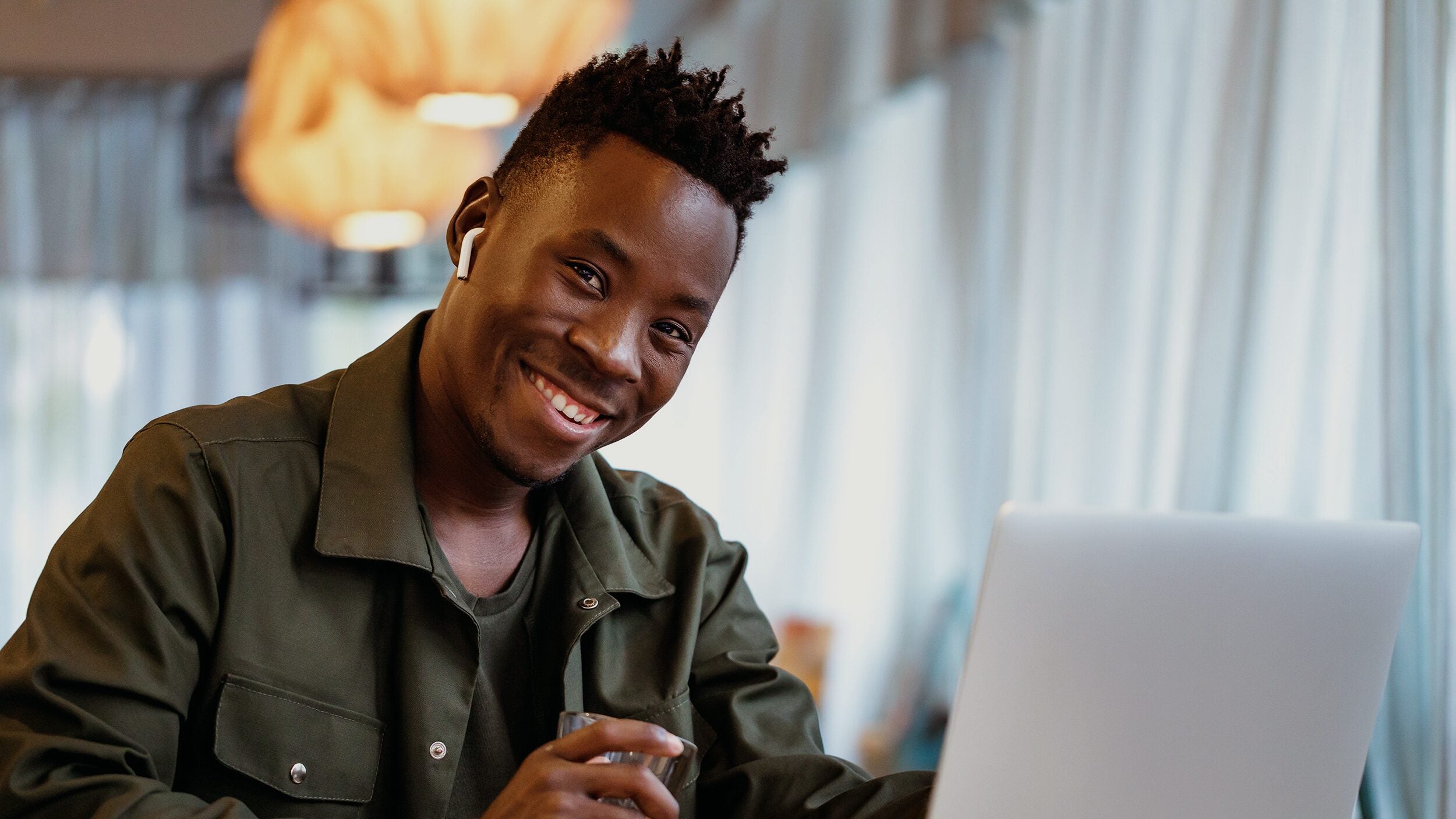Young man studies on a laptop computer.